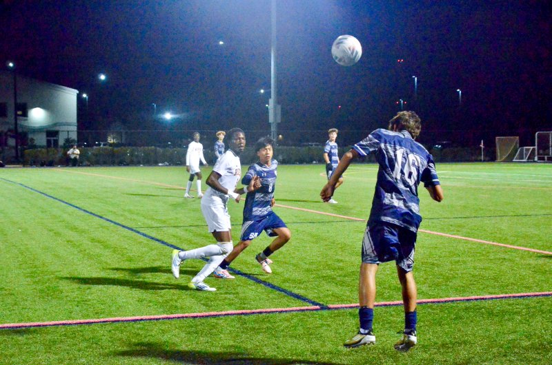 Sussex Academy sophomore Bodhi Williams gives Ruendi Ortiz-Santos a head start.