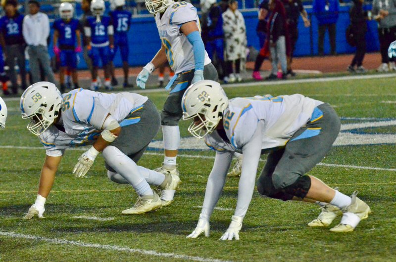 Cape senior Liam Ramsey, right, and freshman Javier Morales-Roblero await the snap.