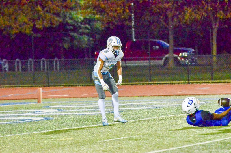 Cape senior Ty Handy jumped back and celebrated his tackle that turned the ball over and put the Dover defense with its back against the goal line.