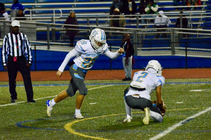Cape junior Austin Tyndall strides toward the ball on a point-after try.