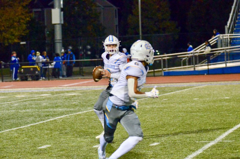 Viking senior Mikey Thompson drops back as freshman Jameson Pease swings out of the backfield. Thompson threw for a score in the game.
