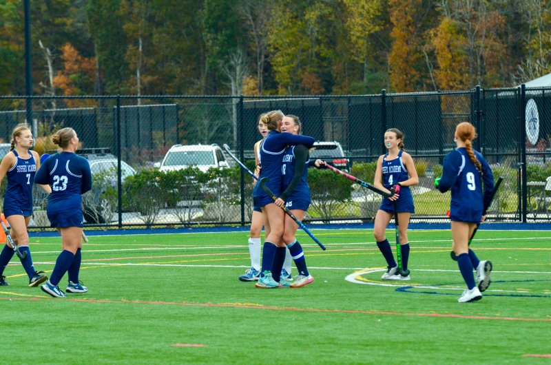 Sussex Academy senior Ryan Lowe hugs her classmate Shea Danahy after Lowe scored the opening goal of the 4-1 win over Sanford Oct. 29. AARON R. MUSHRUSH PHOTOS