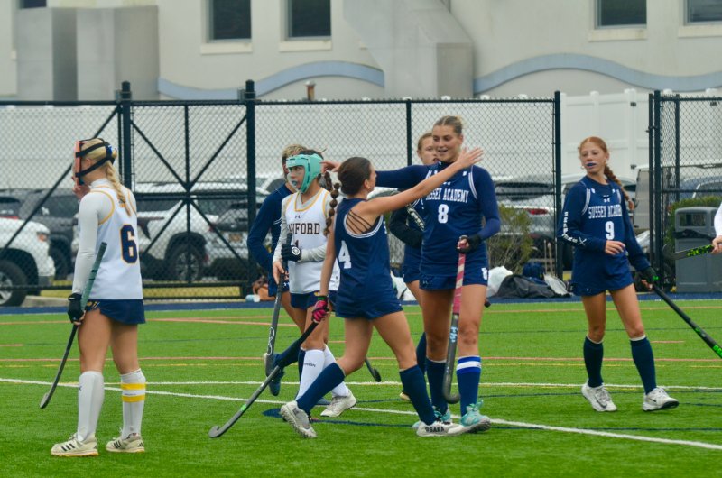 Seahawks freshman Mady Lehman hugs senior Ryan Lowe after she registered a hat trick.