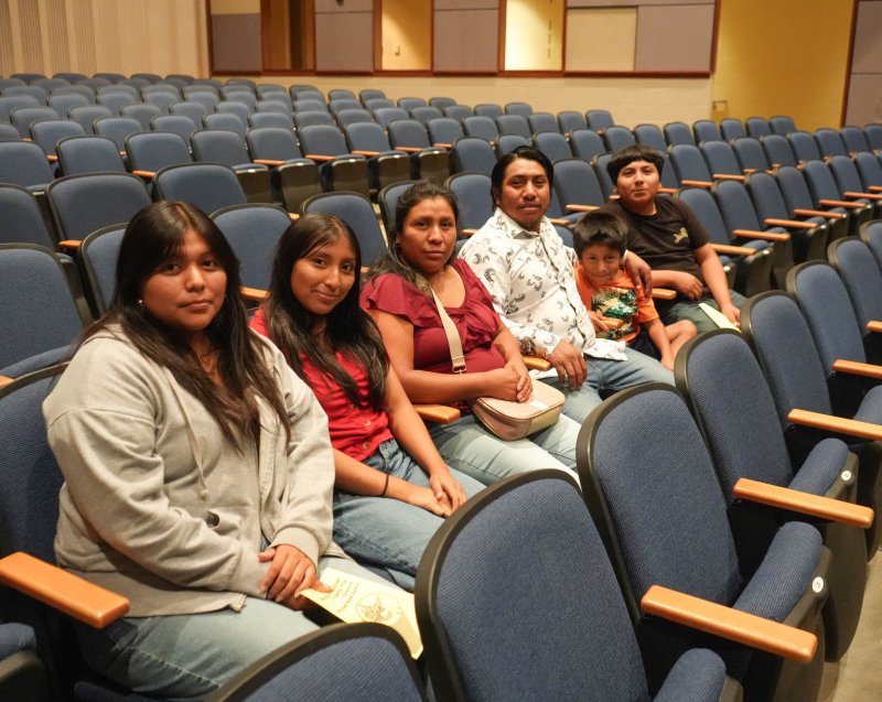 Awaiting the ceremony are (l-r) Marleny and Yonaidys Martin, both students, along with family members Margarita Martin, Nery Velasquez, Anderson Velasquez and Carlos Martin.