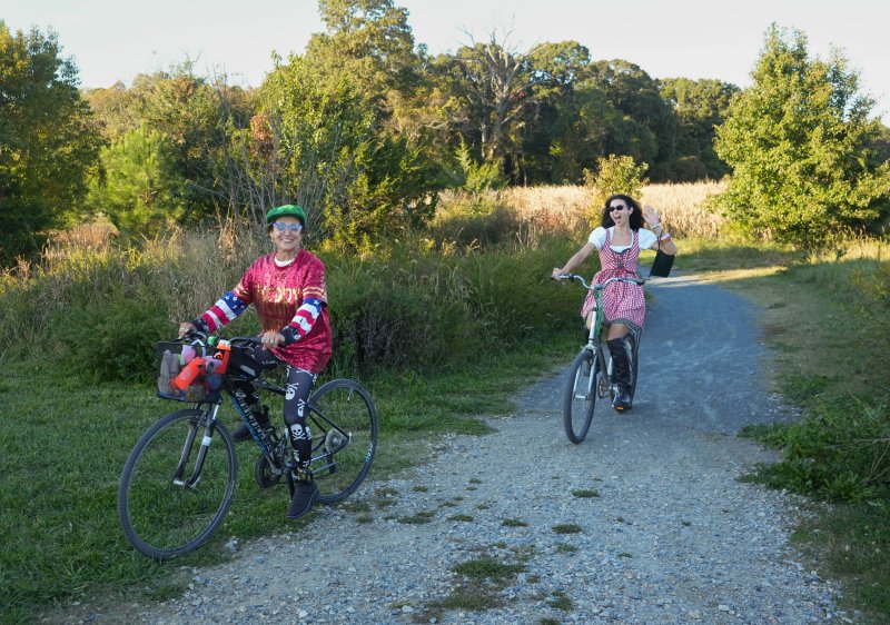 The Cannons, including Ava, left, and Coryn, soak up the sun during the Dilly Dally Cruiser Rally bike ride along the Junction & Breakwater Trail on the western edge of Cape Henlopen State Park Oct. 18. The two sport costumes for the event. ELLEN MCINTYRE PHOTOS