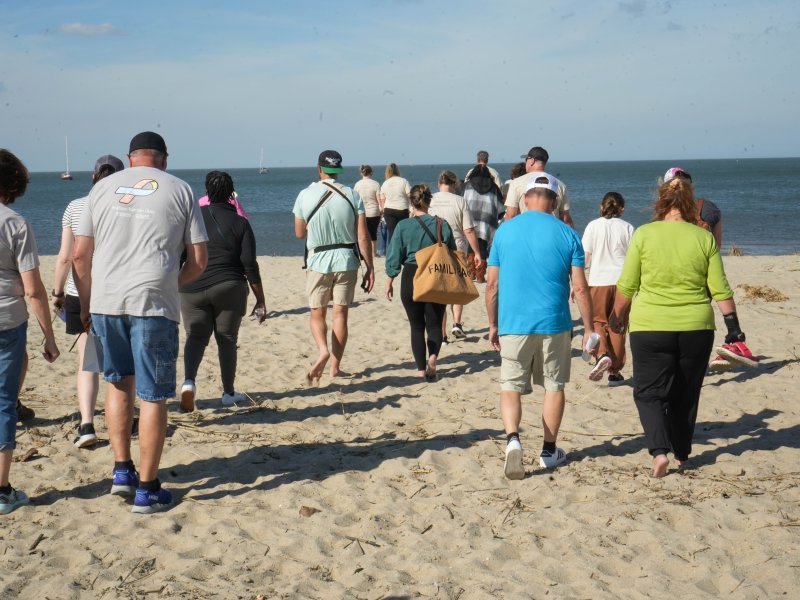 Participants head down to the bay to release flower petals into the water in honor of the infants they’ve lost.
