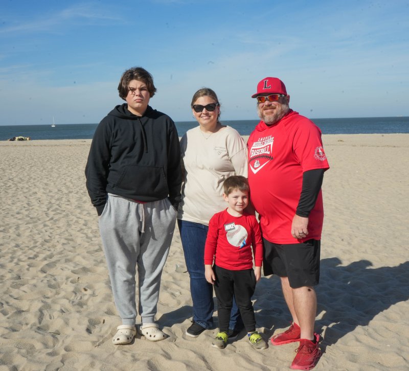 The Tyndalls stand on the beach after the memorial service. Shown are (l-r) Noah, Wendy, Asher and Brooks.