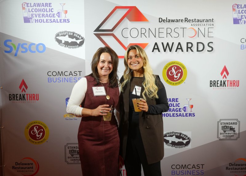 Enjoying the night are Alisa Clayville, left, and Natalie Smith of Breakthru Beverage, one of the event sponsors.