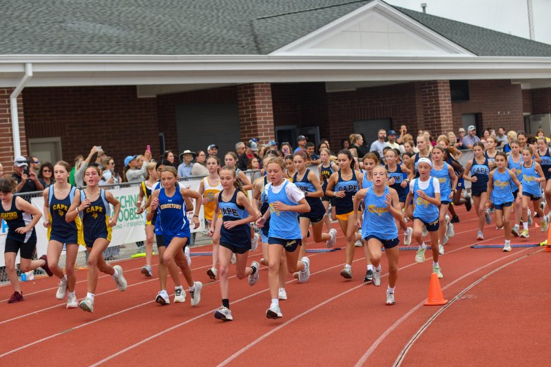 Middle school cross country girls step off the starting line at Cape.