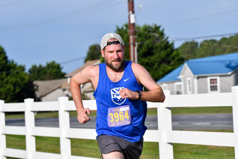 Tim Pagano wins the race in 17:39.