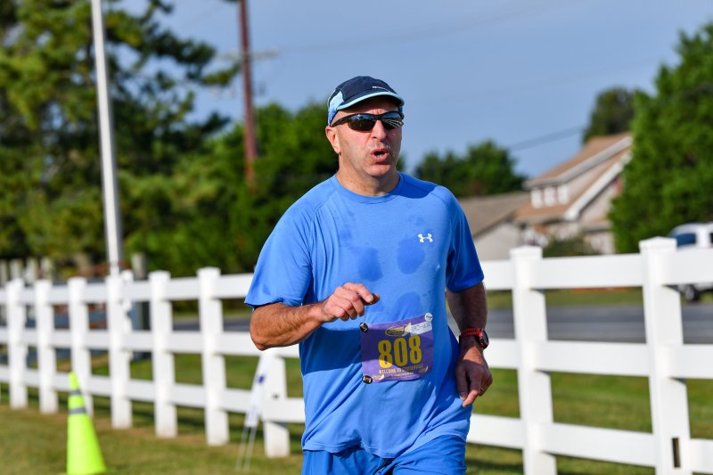 Rick Hughes, 55, wins the male masters title in 20:25.
