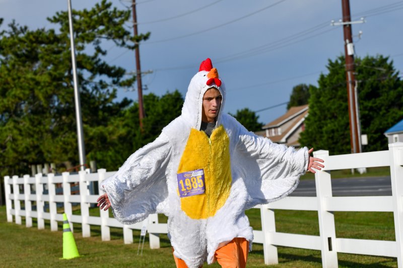 Owen Beitzel runs the Lace Up for Ag Literacy 5K at Hopkins Farm in a chicken suit. He placed fourth.