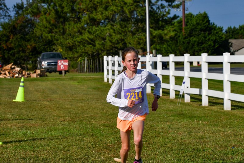 Erin Rickenback, 9, takes second in the female race in 22:53.