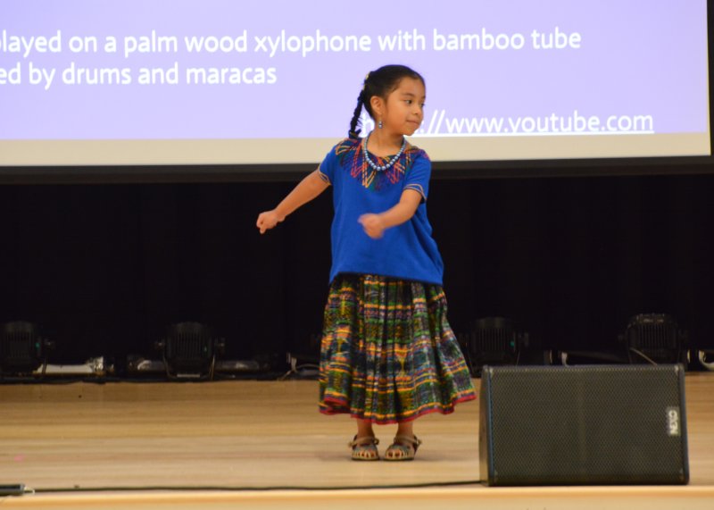 Danha Lopez dances to the marimba, a palm wood xylophone with bamboo tube resonators, that is accompanied by drums and maracas.