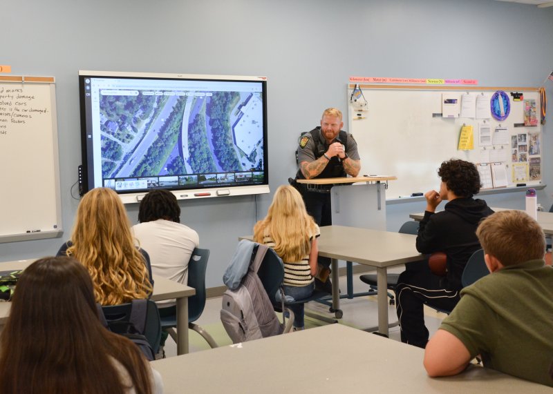Listening intently as Cpl. Nick Yatsko discusses his final accident scenario are Fred Thomas Middle School students (l-r) Ainsley Zachary, Brynn Evick, Elijauh Whaley, Anna Louden, Ayden Bonilla-Merced and Ryan Jennings. SUBMITTED PHOTOS