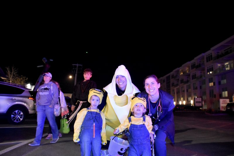 Jay, 3, and Aaron, 1, arrive at Dickinson Street dressed as Minions.