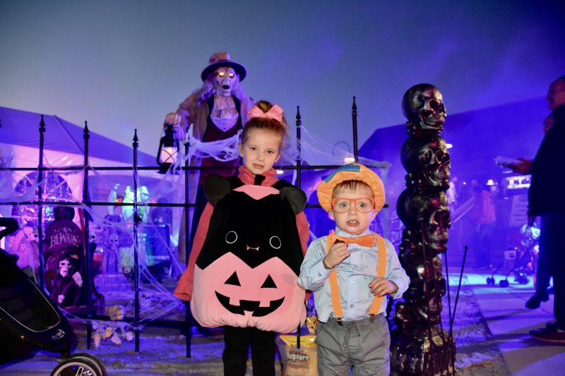 Trick-or-treaters dress as Blippi and a Squishmallow.