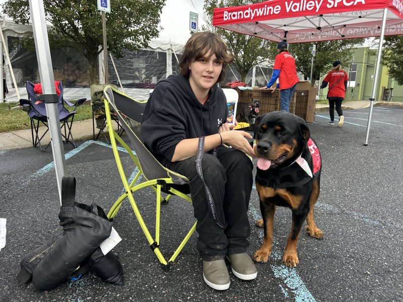 Bryanna Evans, a volunteer with Brandywine Valley SPCA, is all smiles with Christina, a 1-year-old Rottweiler mix whose full name is Christina Waguilera.