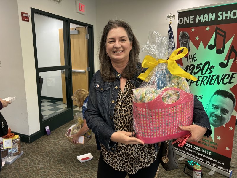 Diane Bitterle takes home a basket won during the gala’s raffle drawing.