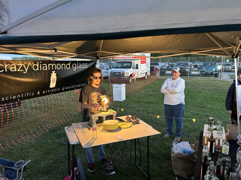 Corey Sadler does a live glass-blowing demonstration.