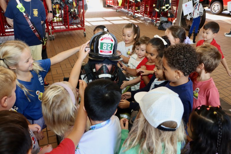 Students are encouraged to touch firefighter Liam Stabner in his full gear. The hands-on lesson is meant to teach kids that they should not be afraid of firefighters.