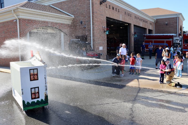 One of the highlights of the day for students is getting to use a real fire hose to put out a make-believe house fire.