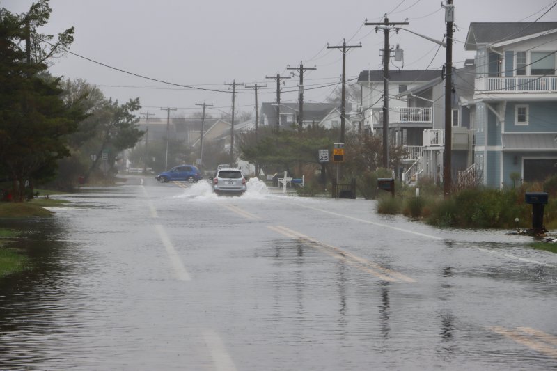 Cedar Street was open, but many cars turned around rather than drive through flood waters Oct. 13. BILL SHULL PHOTO
