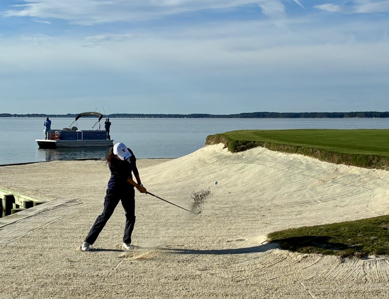 Emma Lee probably never thought that two guys in a pontoon boat would be around to see her hit out of a bunker during a college golf tournament. The Yale University freshman from Scarsdale, N.Y., hit a good bunker shot recovery on the par 3 19th hole.