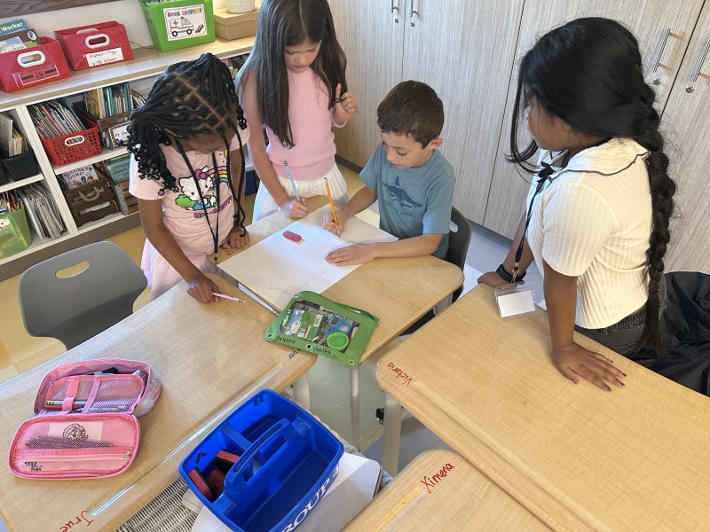 Teaming up to learn about poetry and shared values are (l-r) Jrue Paul, Ximena Weldon, Bryant VanPelt and Victoria Roblero Gonzalez.