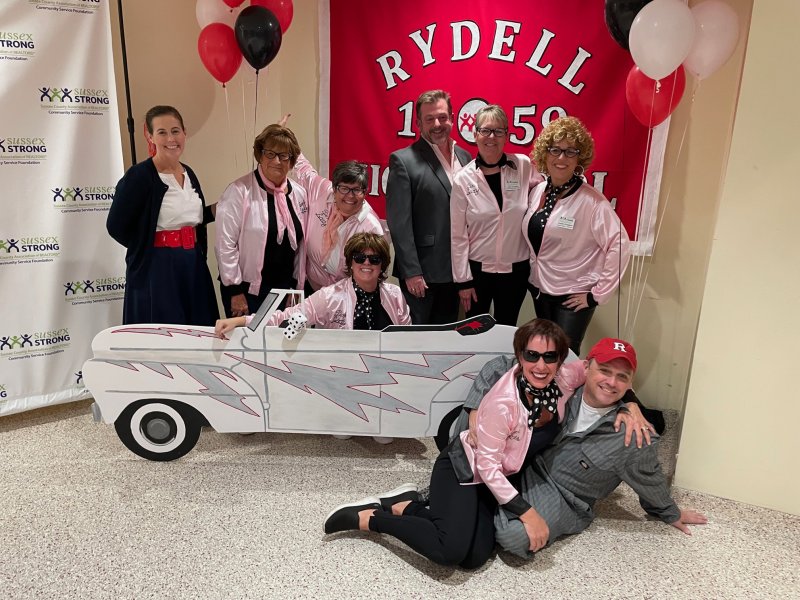 Sussex Strong 2022 board of directors members going all out on the gala’s “Grease” theme are in back (l-r) Stephanie Moody, Audrey Serio, Jenn Barrows, Kristina Broadbent, Joe Della Torre, Kathy Douglass and Josette Castiglione. In front are Brigit Taylor and Robb Kimbles. 
This year’s theme for the Nov. 9 Sussex Strong Gala is Party Like It’s 1999. FILE PHOTO