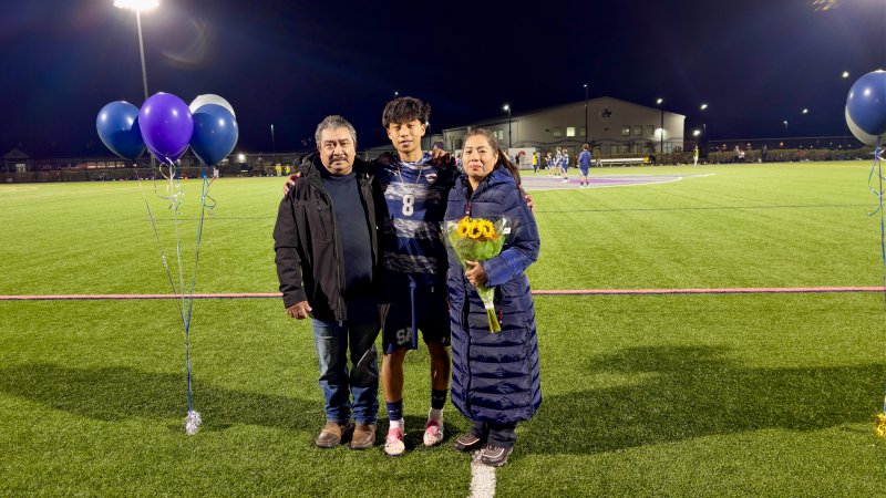Leonel Ortiz and Margarita Santos made their way across the turf with Sussex Academy senior Ruendi Ortiz-Santos.