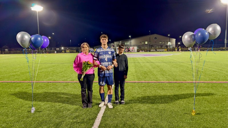 Sussex Academy senior Ben Steimel trekked across the turf with Desiree and Jacon Steimel.