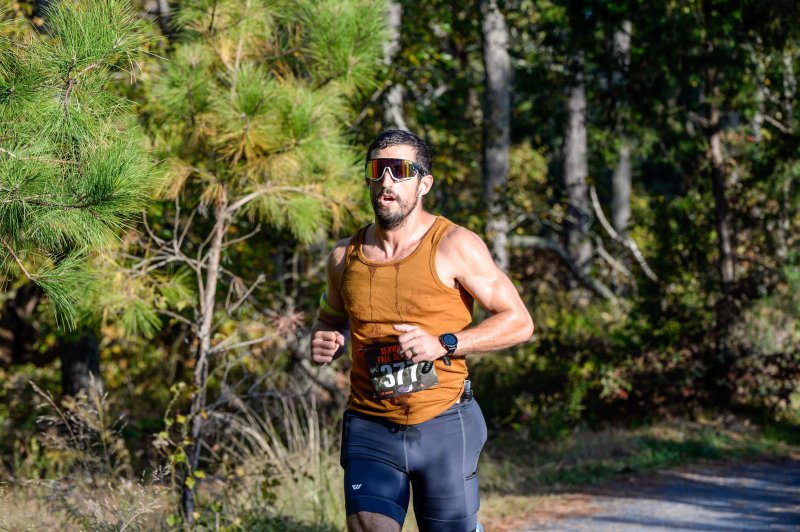 Brett Stinson wins the half marathon in 1:24:23.