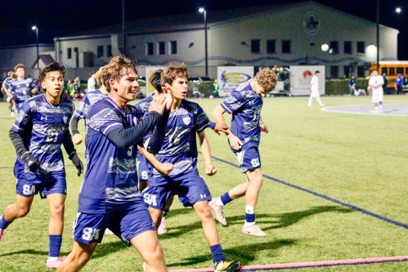 Seahawks senior George Sapna, left, and sophomore Bodhi Williams lead the celebration charge after the former finished off a pass from the latter for a 2-0 lead.
