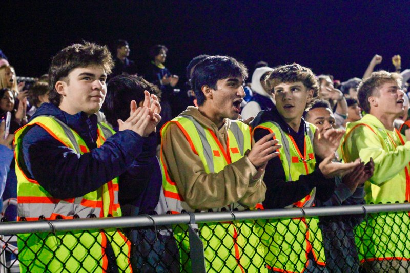 The boys (l-r) Derek Sachs, Armaan Chadha, Cole Bunting and Jack Meszaros approve of the lads’ work on the pitch. AARON R. MUSHRUSH PHOTO