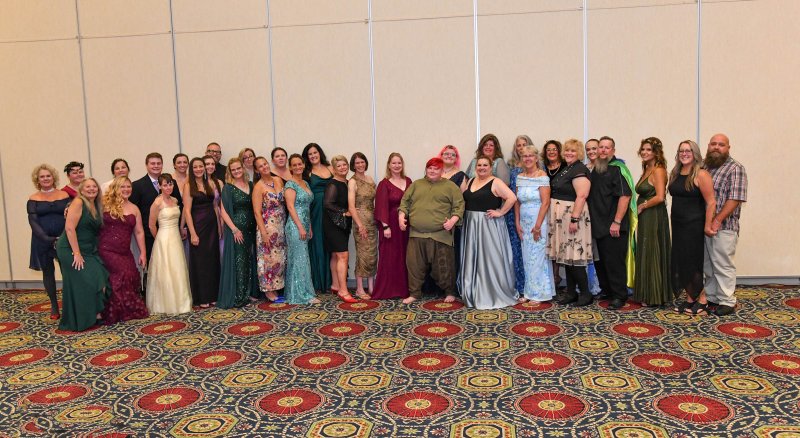 Grass Roots Rescue volunteers get together for a team photo at the annual Heels and Hooch gala. DAN COOK PHOTOS
