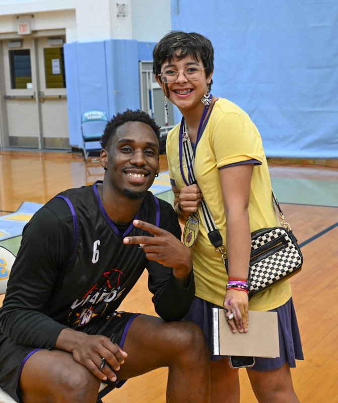 Alex Hearn gets her photo with Glitch, aka Bakari Copeland.