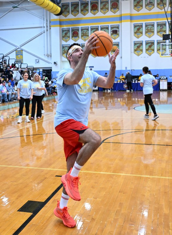 Cape Crusader Charlie Sokaitis of Coast TV goes in for a lay up during the pre-game warm up.