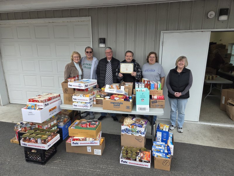 Community representatives deliver donations to Milton food pantry
