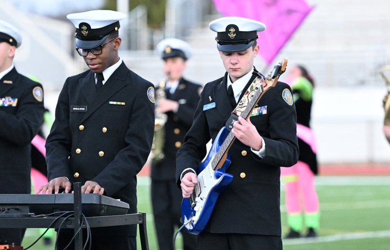 DMA’s Ifedolapo Abiola-Otun on keyboard and Chance Harrison on guitar front the Seahawks’ band.