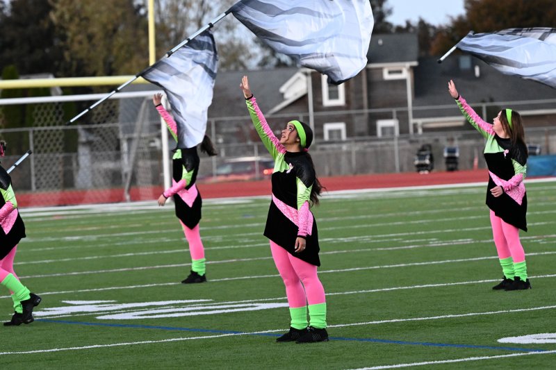 Liana Abreu, left, and Abby Hoffman perform with the DMA color guard.