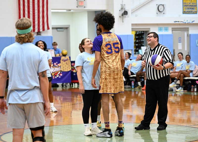 Referee Justin Marino, right, gets ready to toss jump ball between Julianna Danese and Sky-Rise.