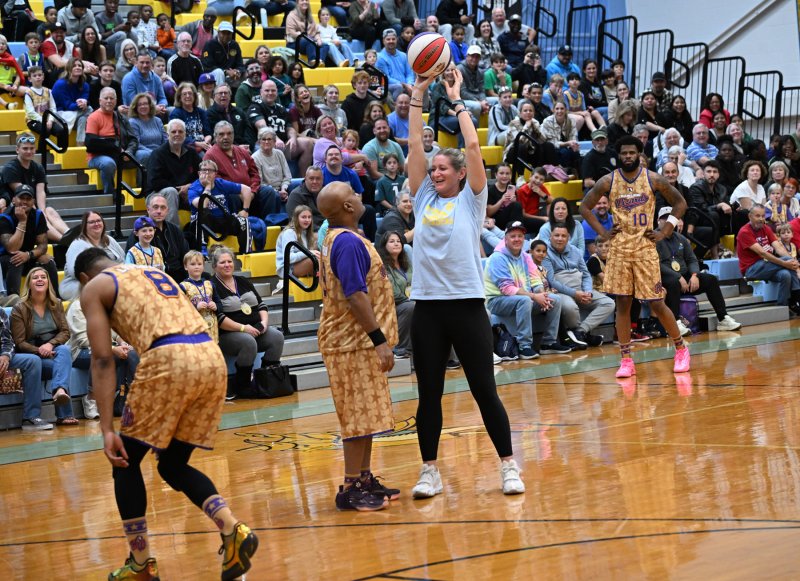 Cape Crusaders forward Katie Tingle keeps the ball away from Wizards’ guard A-Train.