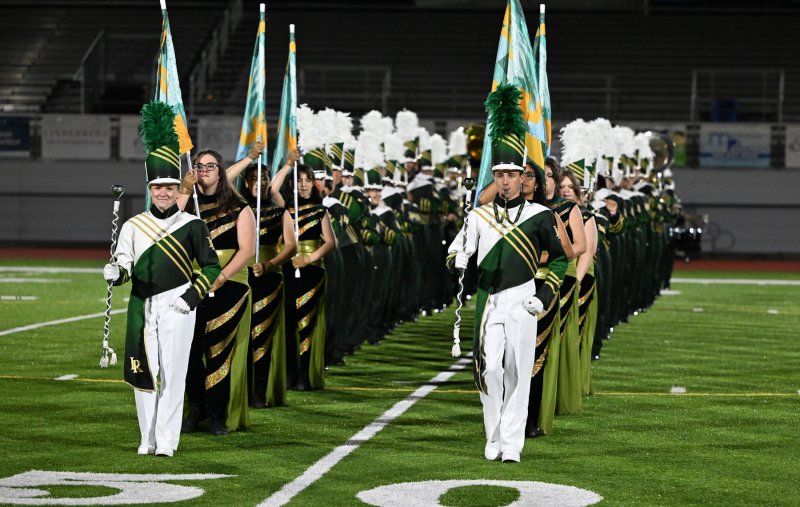 Alison Swartz, left, and Logan Truitt lead the Indian River marching band.