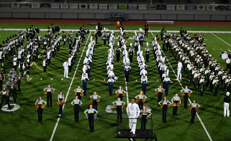 Julia LaCrette directs the marching bands.