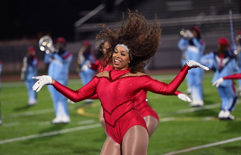 Mariah Mullins shakes it off with the Marching Hornets dance team.