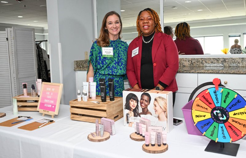 Michelle LeCates, left, and Danecia Page represent Mary Kay.