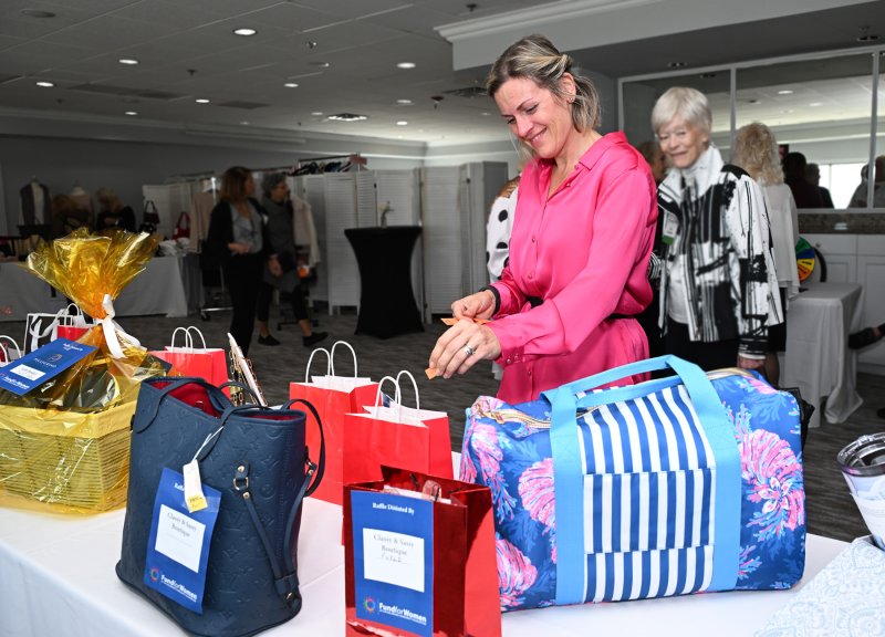 Andrea Vale bids for a bag in the raffle.