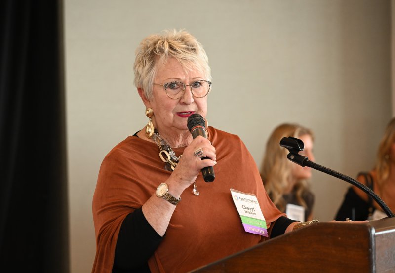 Founder and committee member Cheryl Mitchell acts as emcee for the event.