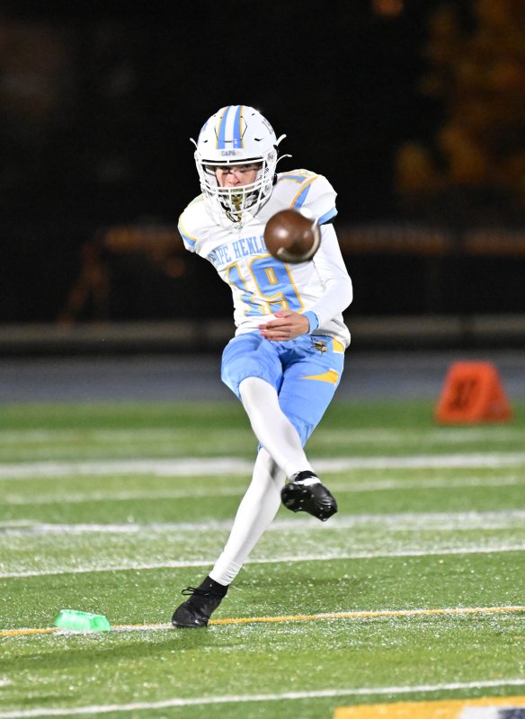 Place kicker Samuel Schubert boots a kickoff.